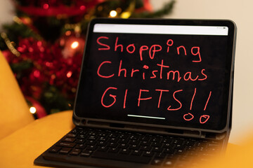 tablet or laptop with christmas shopping note
