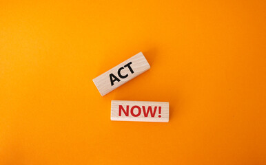Act now symbol. Wooden blocks with words Act now. Beautiful orange background. Business and Act now concept. Copy space.