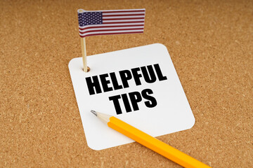 On the table is the US flag, a pencil and a sheet of paper from a notebook with the inscription -...
