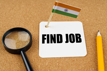 On the table is the flag of India, a pencil, a magnifying glass and a sheet of paper with the inscription - find job