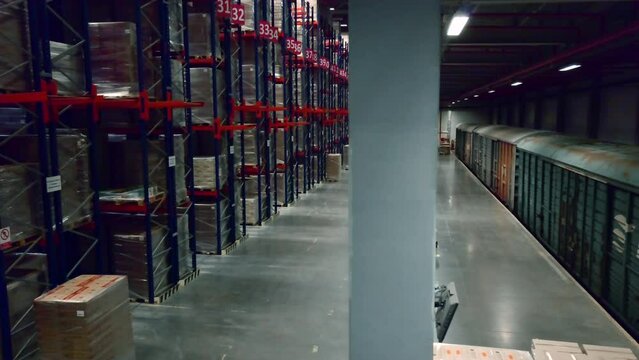 Busy work. Creative. A large warehouse room where visiting trains unload and package goods at the post office.