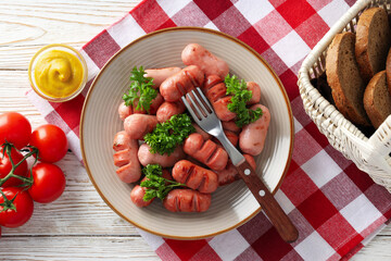 Concept of tasty food, grilled mini sausage, top view