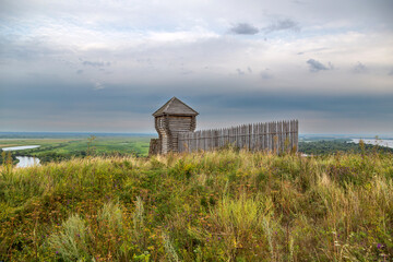 Ancient wooden fortress on a background of river spaces. Russia, Tatarstan, ancient Bulgar fortress in Yelabuga