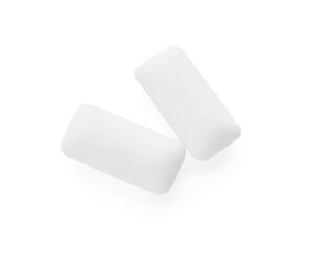 Two pieces of chewing gum on white background, top view