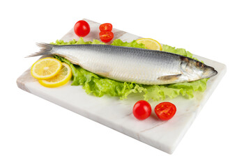 Board with salted herring, slices of lemon, lettuce and cherry tomatoes isolated on white