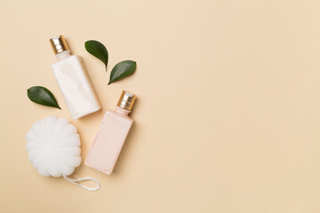 Shower gel with washcloth on color background, top view