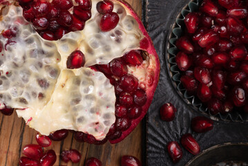 Pomegranate.  Spongy, white membrane of a pomegranate with the seeds or arias spilling out. - obrazy, fototapety, plakaty