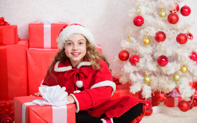 Santa bring her gift. Winter shopping sales. Christmas spirit is here. Winter holiday tradition. Kid happy with christmas present. Girl celebrate christmas open gift box. Unpacking christmas gift