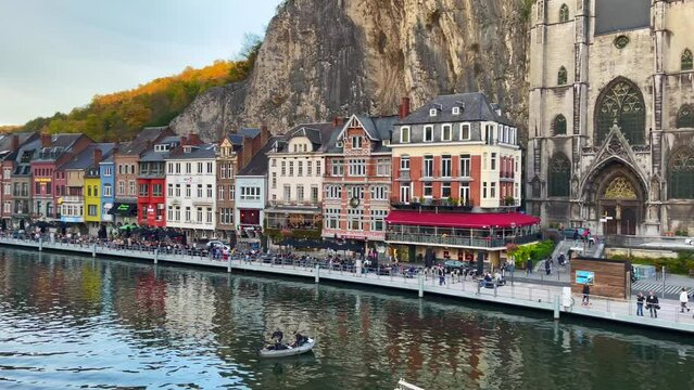 Large ferryboat sailing on the Meuse river in Dinant, Belgium