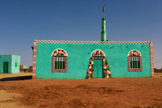 A typical Nubian mosque with vivid colors.; Sudan, Africa.