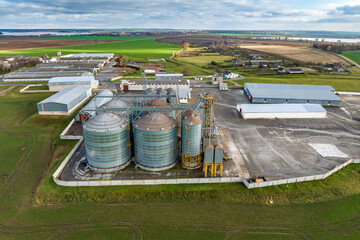 aerial view of huge agro-industrial complex with silos and grain drying line