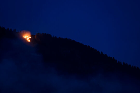 To celebrate the Herz-Jesu, Sacred Heart, festival, the people of the Tannheaim region in Austria climb up the neighbouring mountains and at twilight light fires in religious shapes to acknowledge and