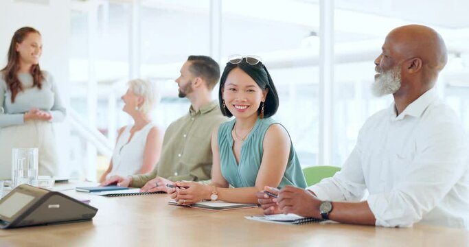 Portrait, meeting and training with a business asian woman sitting in the boardroom during a team seminar. Happy, smile and workshop with a female employee in an office with her colleague group
