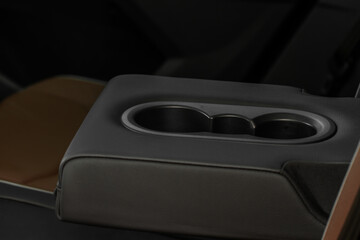 Cup holders inside modern car interior. Interior view of modern car.
