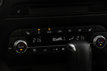 Car air conditioner dashboard. Modern car interior. Adjustable air conditioner. Car air conditioning system.