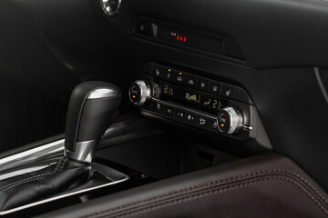 Obraz premium Digital control panel car air conditioner dashboard. Modern car interior conditioning buttons inside a car close up view.