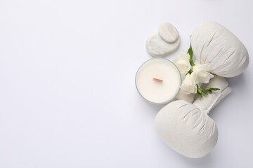 Flat lay composition with different spa products on white background, space for text
