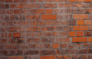 Old brick orange wall with stone places
