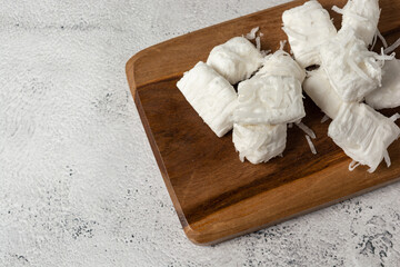 brazilian food bala de coco or brazilian coconut candy, a gourmet homemade sweet dessert made of coconut. top view