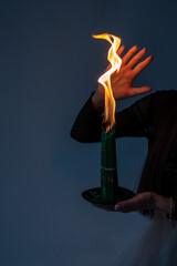 old magical book. the witch performs a black ritual. witchcraft and mysticism. green candles