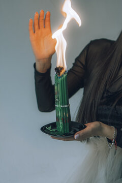 old magical book. the witch performs a black ritual. witchcraft and mysticism. green candles