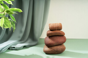 Composition empty podium material tree stone dry flowers. Beautiful green background made of natural materials for product presentation.