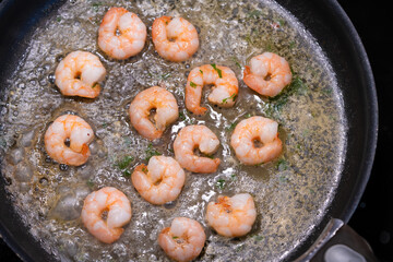 Fried shrimps in teflon pan