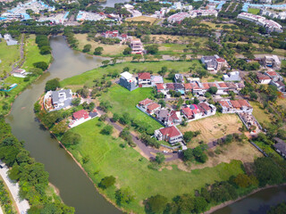 Fototapeta na wymiar Aerial view from the drone above the Luxury real estate named as Balidwipa around the river at citra raya, tangerang