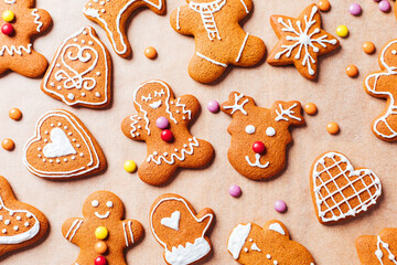 Various selection of Gingerbread cookies with sugar icing. Decorated in Christmas spirit. Happy New Year celebration. Playful and fun. 