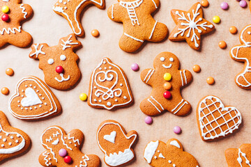 Various selection of Gingerbread cookies with sugar icing. Decorated in Christmas spirit. Happy New Year celebration. Playful and fun. 