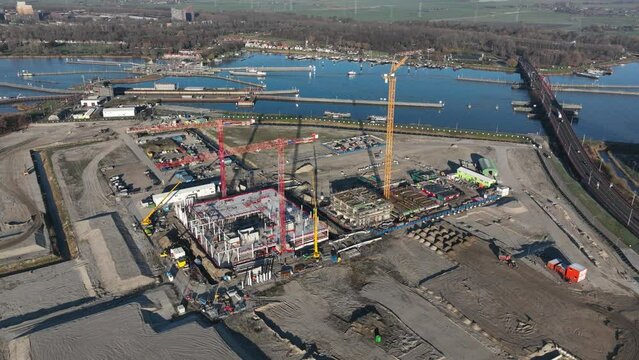 Aerial hyperlapse timelapse of building new urban residential environments. The future Sluisbuurt on Zeeburgereiland in Amsterdam, The Netherlands