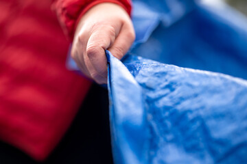 sleeping under a tarp. hiking and camping with a blue tarp