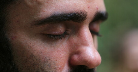 Close-up of man face meditating in nature