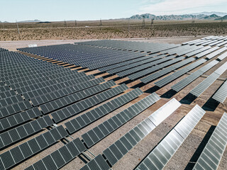 Renewable solar energy solar farm in the desert of southern Nevada on a dry lake bed gathering sun rays and photovoltaic energy to provide sustainable electricity to nearby Las Vegas and other areas