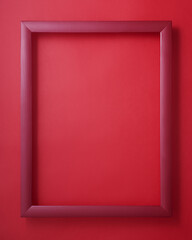 Red picture frame on red background