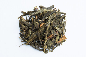 tea leaves over a white background