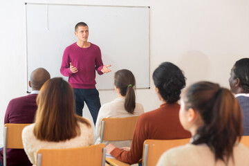 Teacher at the slate explains the lesson to the student