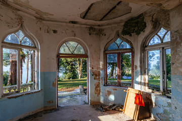 Old shabby room of abandoned mansion in gothic style