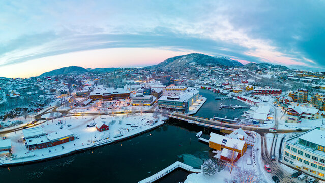 Sunset over the snow covered town center of Os&oslash;yro, Bj&oslash;rnafjorden, Norway
