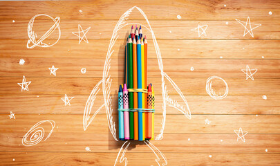 Back to school theme with hand drawn rocket and colored pencils