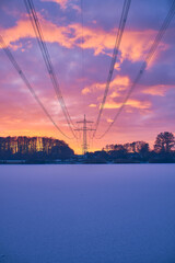 Power line over frozen lake. High quality photo