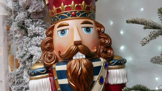 Christmas nutcracker on the background of New Year holiday decorations