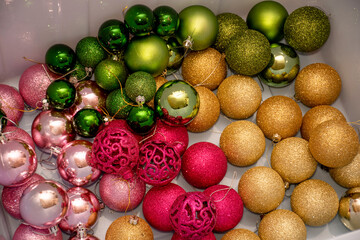 Christmas ornaments baubles in a plastic box ready to decorate a Christmas tree. Storage of Christmas ornaments balls
