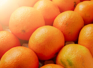 Close up of pile of juicy fresh mandarins or tangerine.