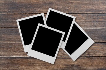 Set of blank photo frames on brown table background