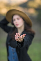 Blurred image of girl holding out her hand