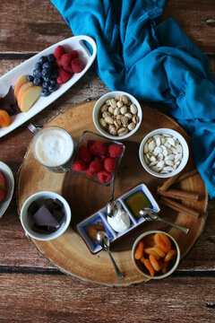 layflat shot fruit and nut charcuterie board one wood backdrop