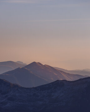 Autumn purple sunset mist above Caucasian mountains