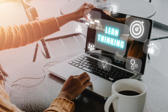 Lean thinking concept, Person using computer in cafe with lean thinking icon on virtual screen.