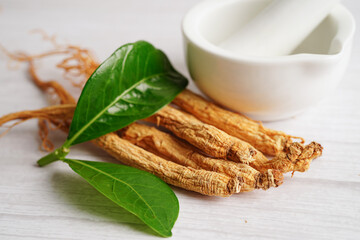 Ginseng roots and green leaf, healthy food.